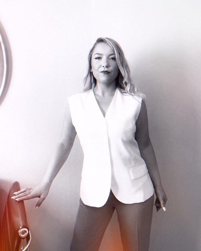 Photoshoot posing in front of a desk 